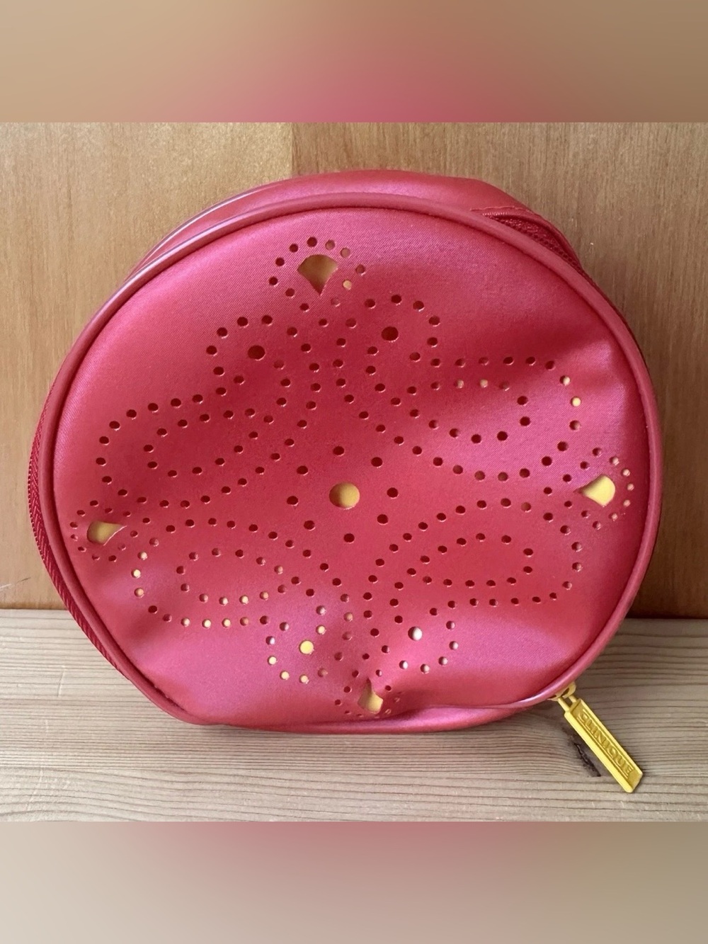 Clinique Pink Round Cosmetic Pouch with Perforated Design